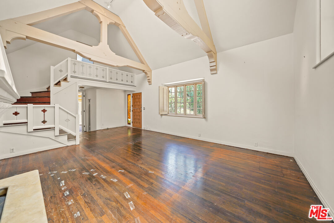 455 El Bosque Laguna Beach, CA 92651 - Photo 7 of 57 a view of a livingroom with wooden floor and stairs
