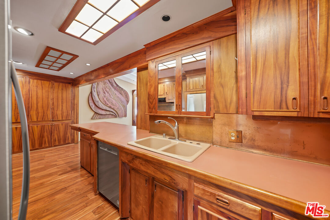 455 El Bosque Laguna Beach, CA 92651 - Photo 10 of 57 a bathroom with a sink and a mirror