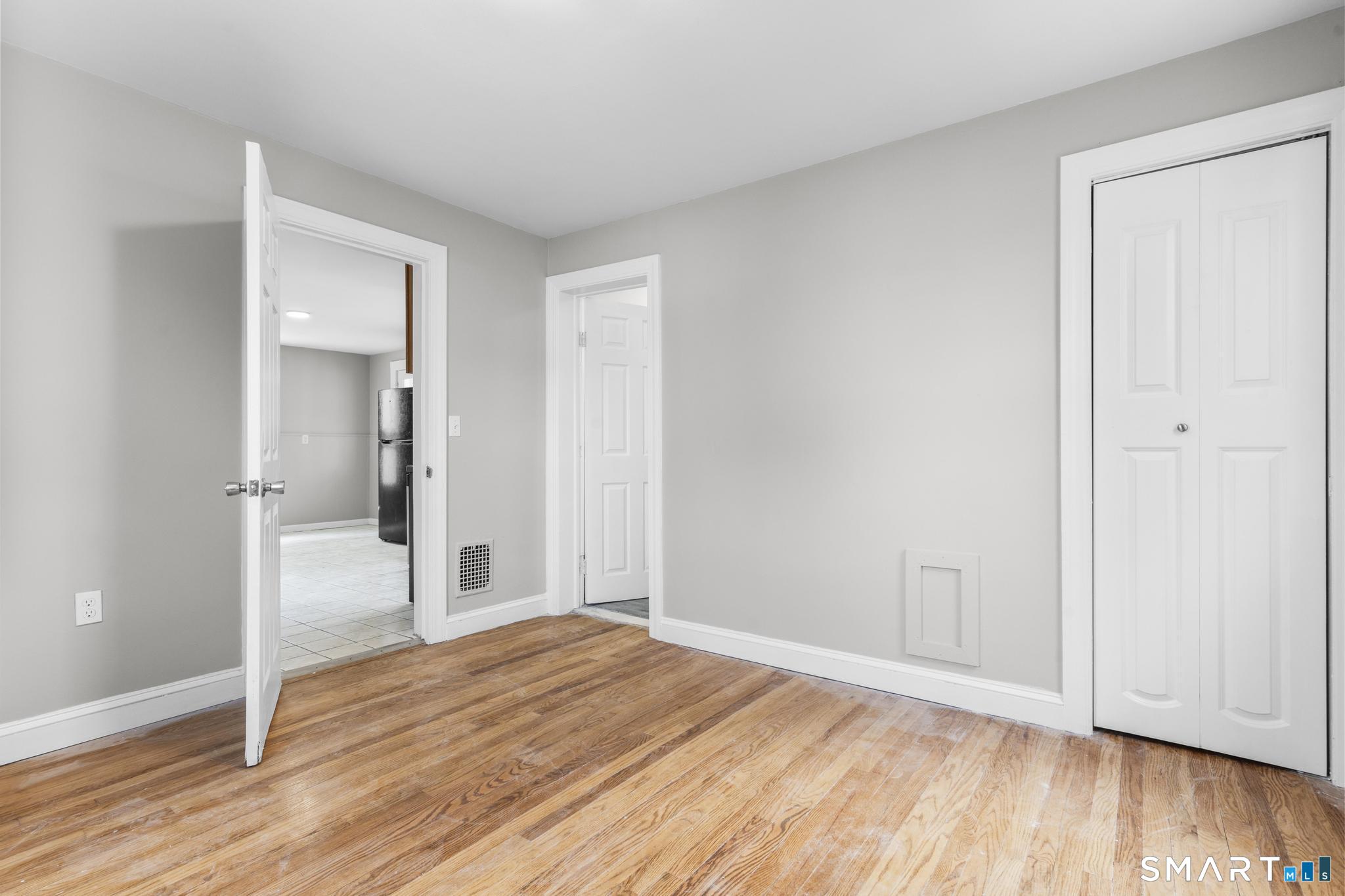 68 Whiting Street Hamden, CT 06514 - Photo 11 of 25 a view of empty room with wooden floor