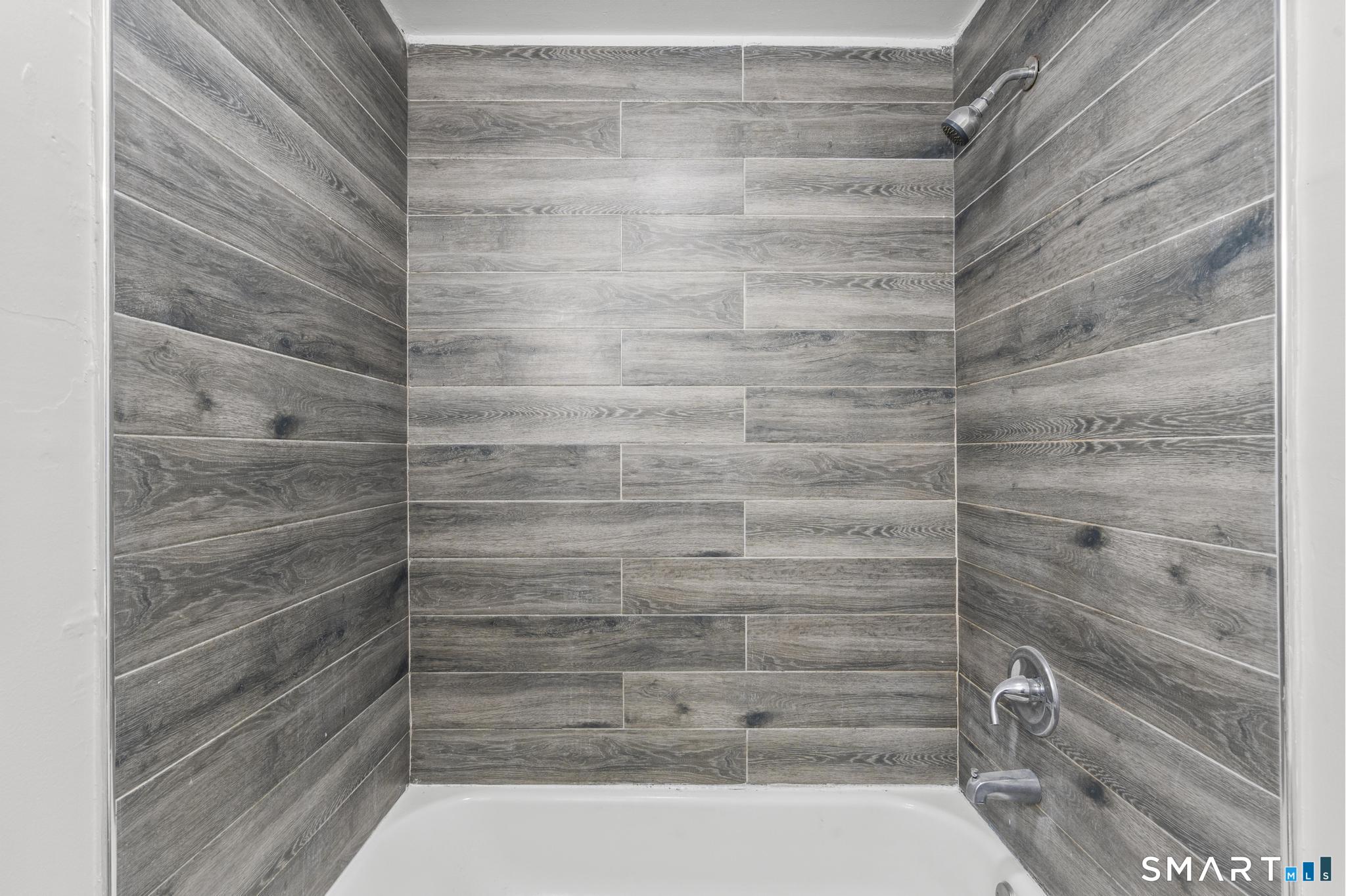 68 Whiting Street Hamden, CT 06514 - Photo 13 of 25 a bathroom with a shower