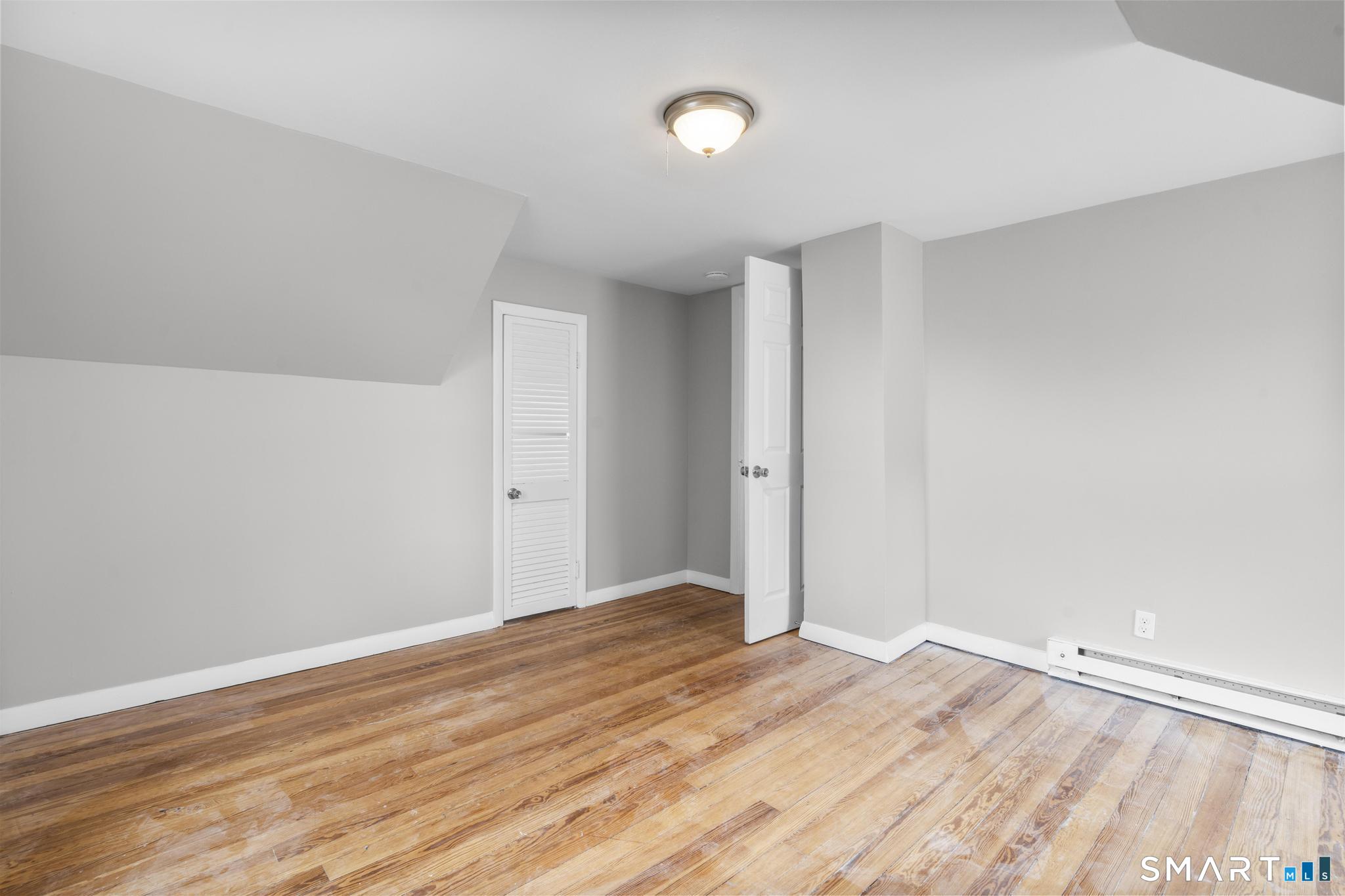 68 Whiting Street Hamden, CT 06514 - Photo 18 of 25 a view of a room with wooden floor