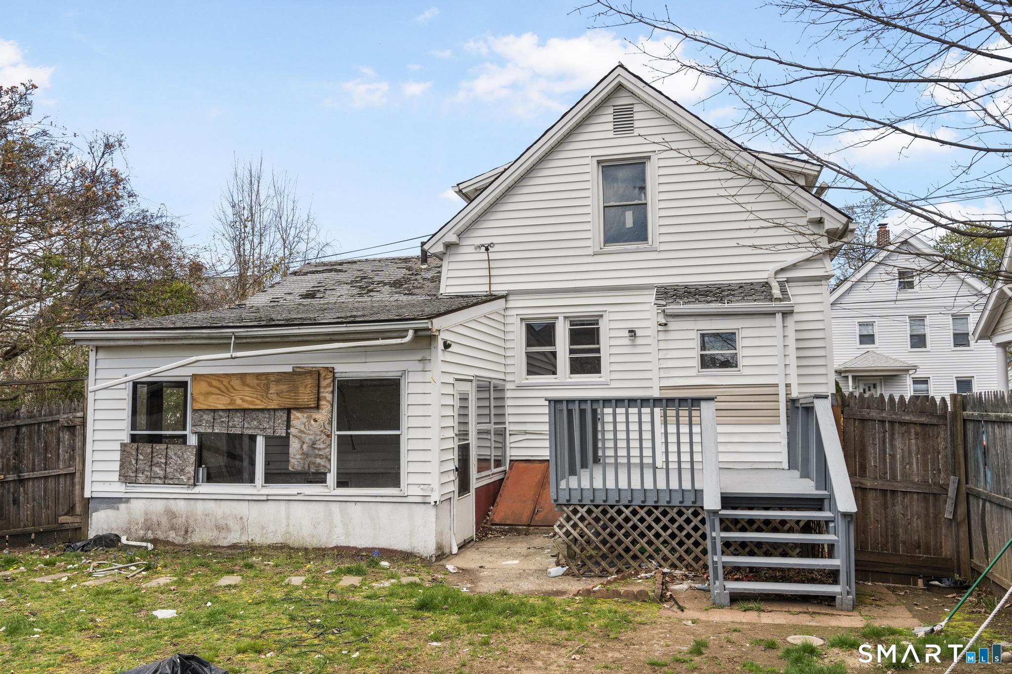 68 Whiting Street Hamden, CT 06514 - Photo 22 of 25 a front view of a house with garage
