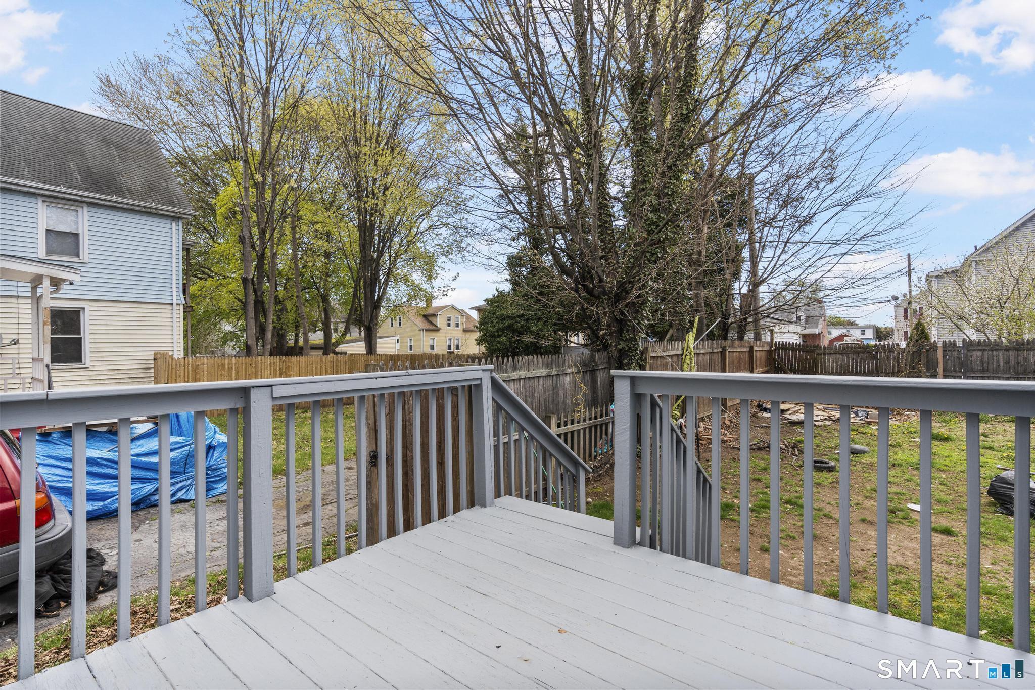 68 Whiting Street Hamden, CT 06514 - Photo 24 of 25 a balcony with wooden floor and fence
