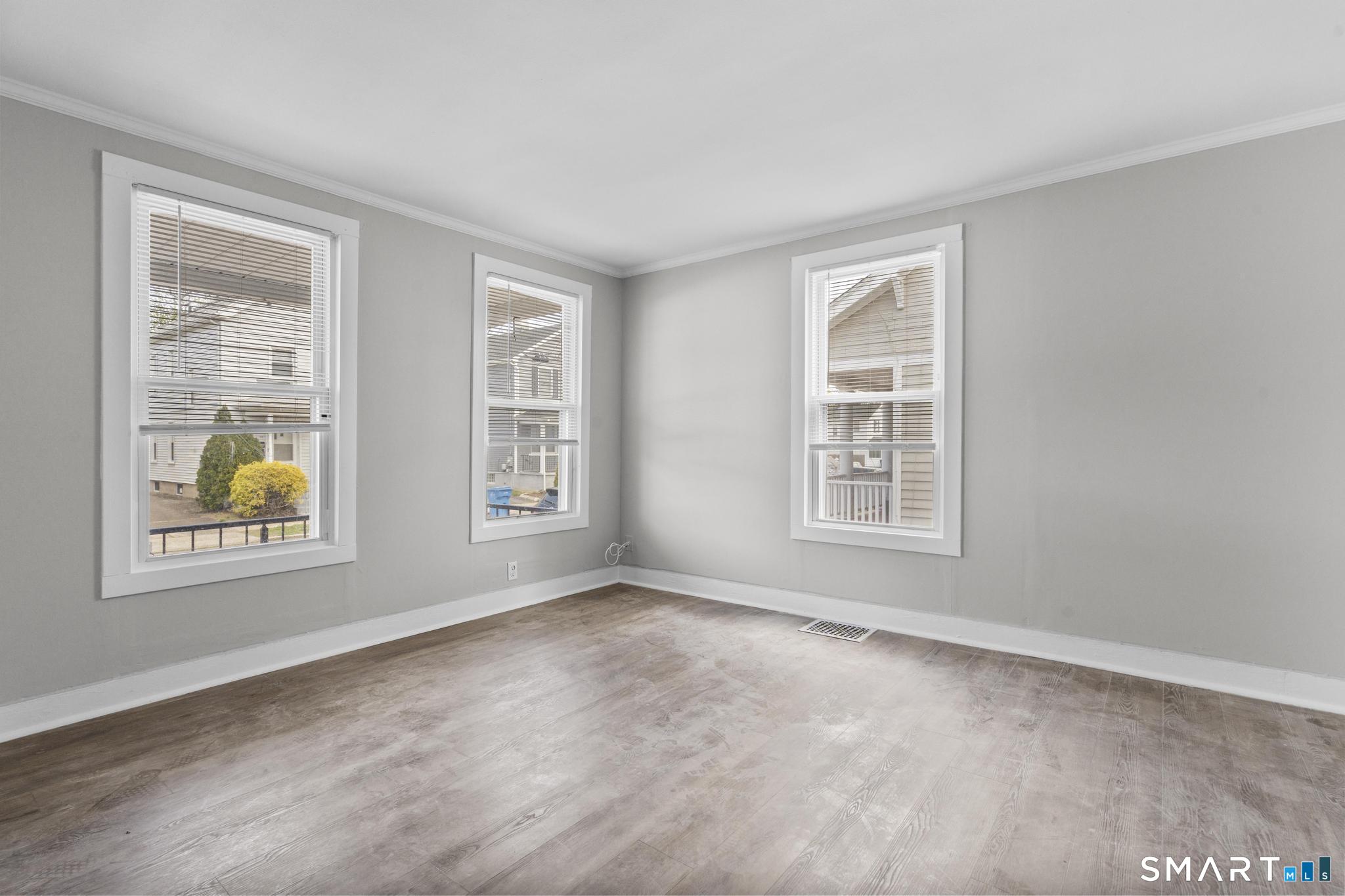 68 Whiting Street Hamden, CT 06514 - Photo 3 of 25 a view of an empty room with a window