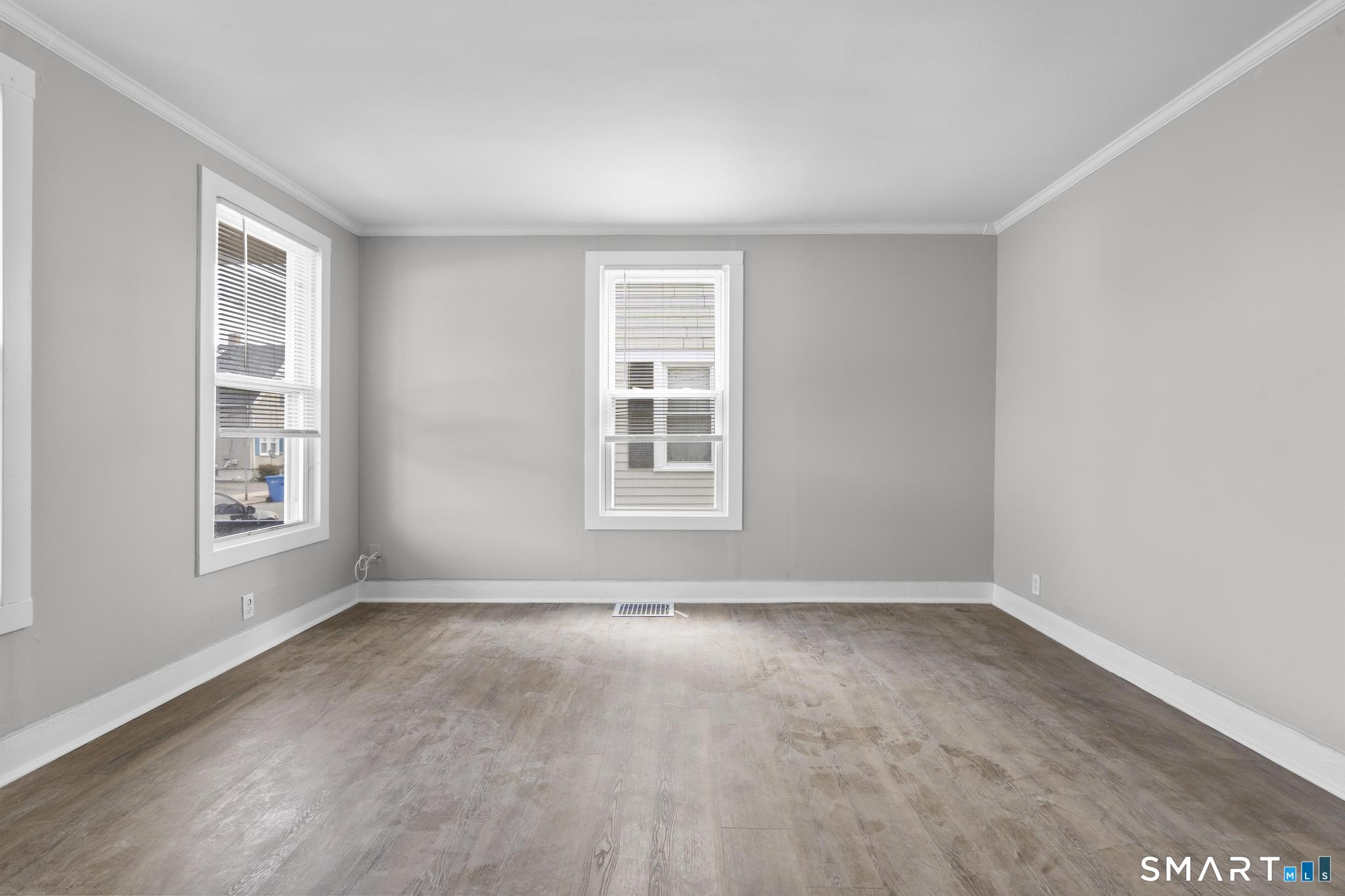 68 Whiting Street Hamden, CT 06514 - Photo 4 of 25 a view of an empty room with a window