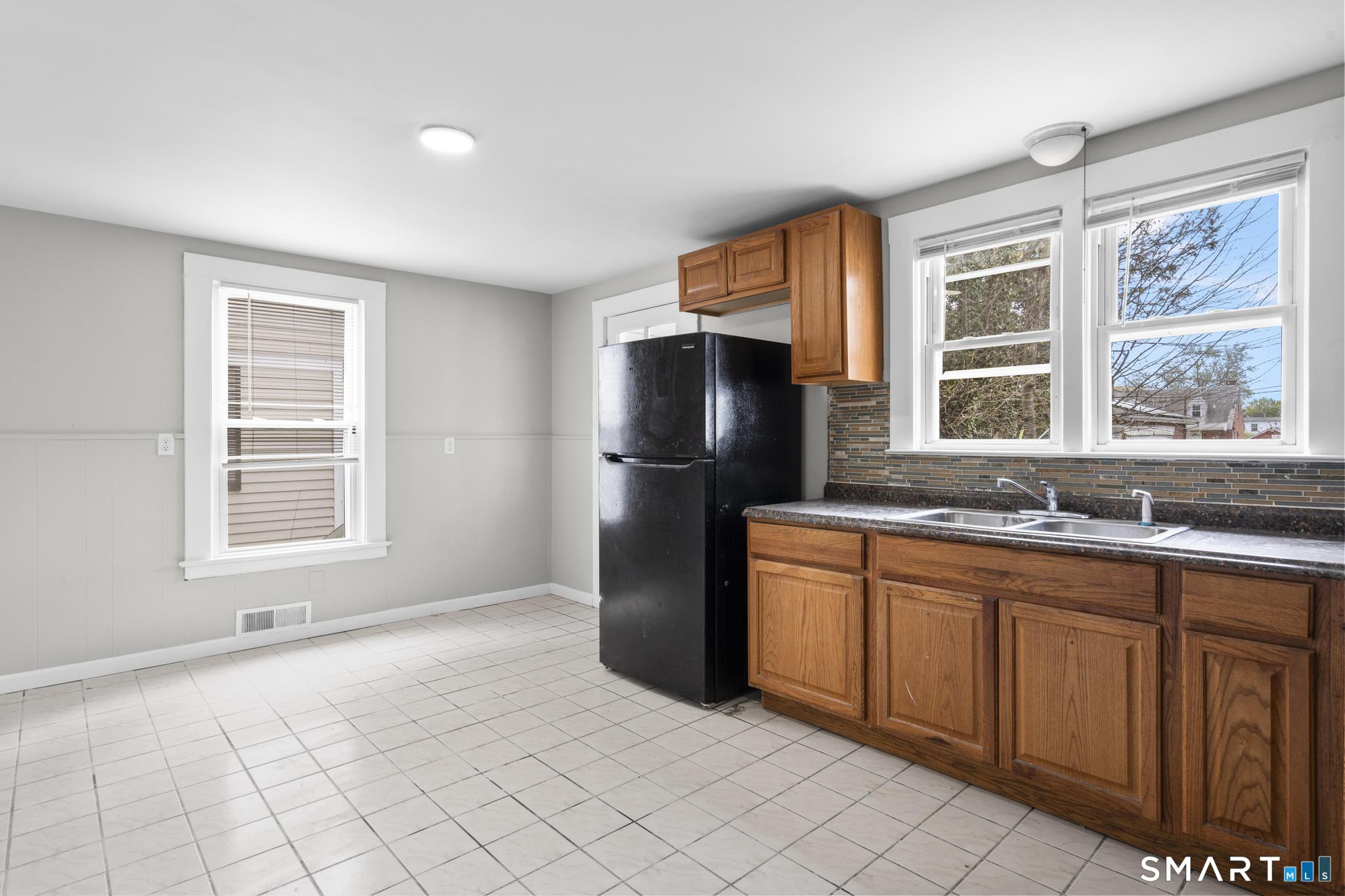 68 Whiting Street Hamden, CT 06514 - Photo 6 of 25 a kitchen with stainless steel appliances granite countertop a refrigerator and a sink