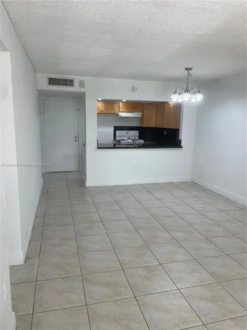 a view of a kitchen with a sink and a stove