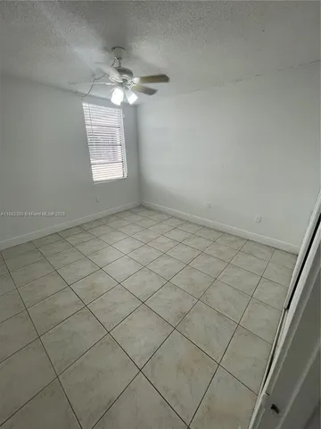 a view of a livingroom with windows