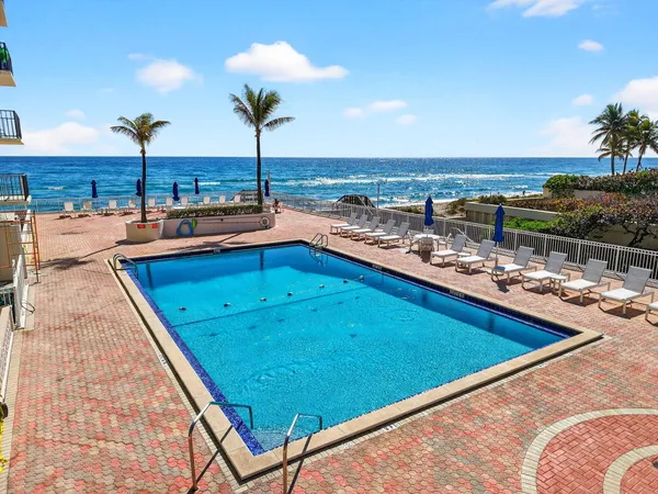 a view of swimming pool from a balcony