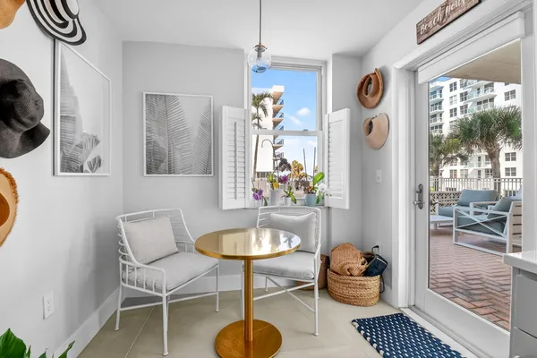 a dining room with furniture and window