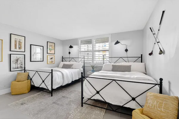 a bedroom with a bed and window