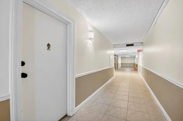 a hallway with table and window