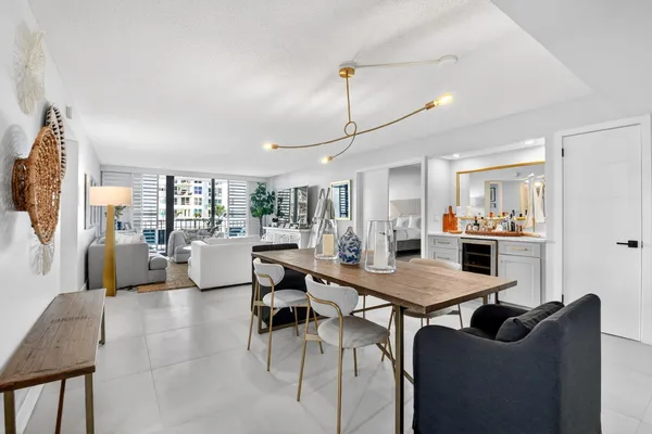 a dining room with furniture and wooden floor