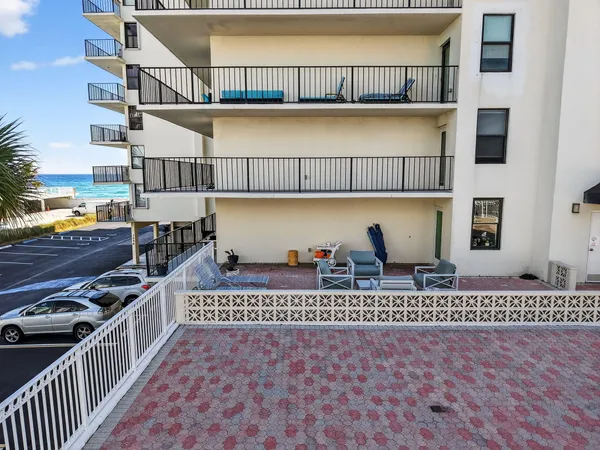 a view of a porch with wooden floor