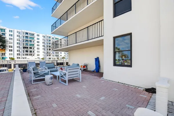 a living room with patio furniture and a window
