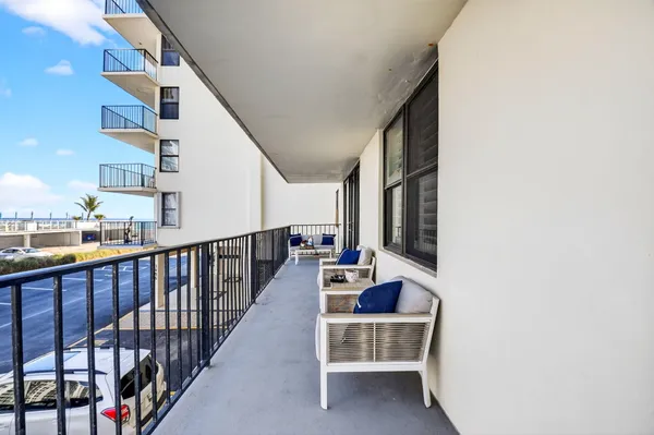 a view of balcony with furniture