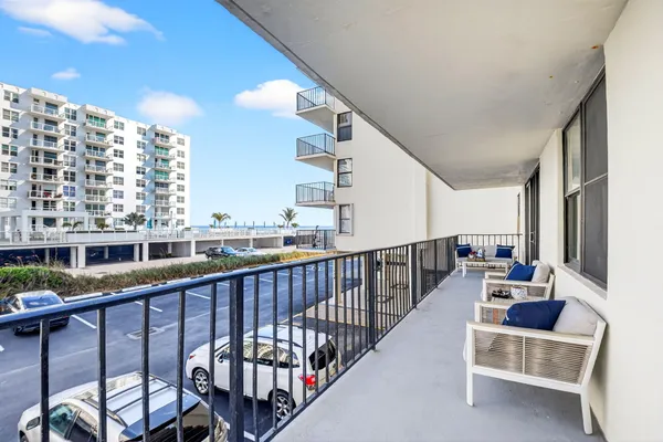 a view of balcony with furniture