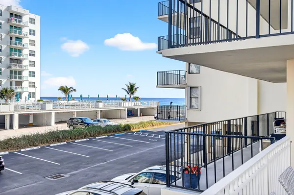 a view of balcony with outdoor seating and wooden floor