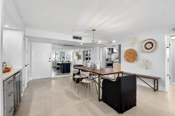 a living room with furniture and a clock
