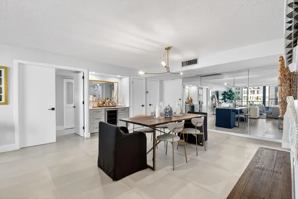 a view of a dining hall with furniture and wooden floor