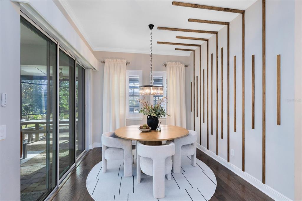 9374 Reymont Street Orlando, FL 32827 - Photo 11 of 54 a view of a dining room with furniture window and wooden floor