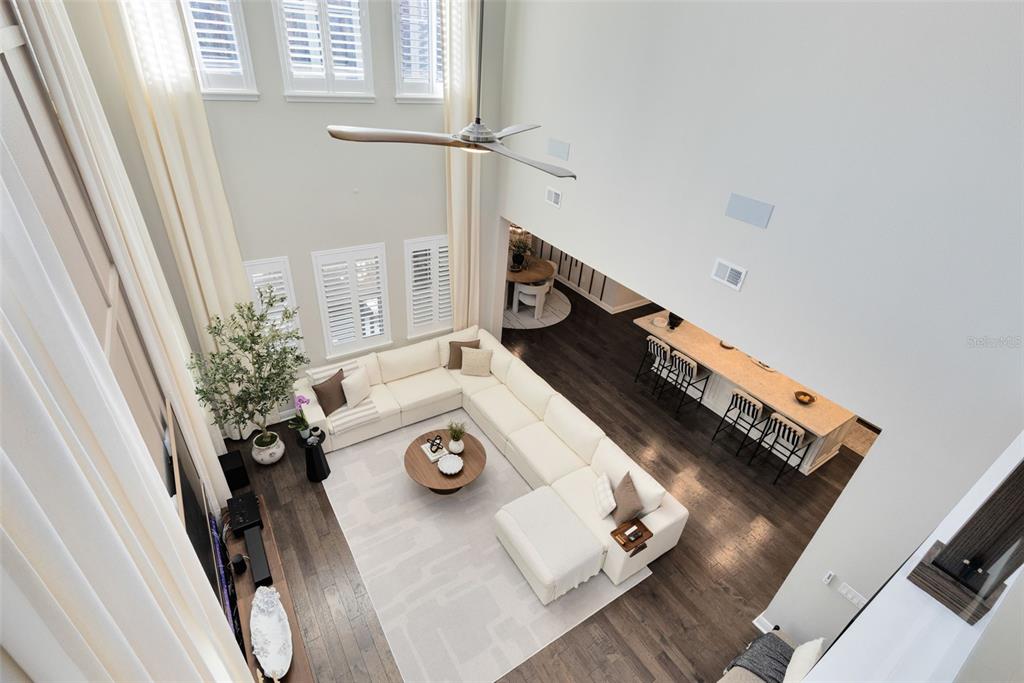 9374 Reymont Street Orlando, FL 32827 - Photo 13 of 54 a view of dining room with furniture and wooden floor