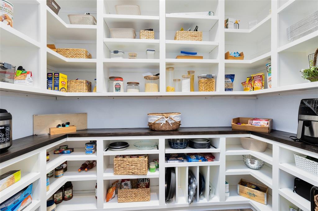 9374 Reymont Street Orlando, FL 32827 - Photo 15 of 54 a cabinet with a book shelf