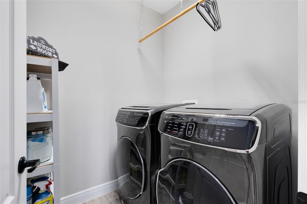 9374 Reymont Street Orlando, FL 32827 - Photo 17 of 54 a utility room with dryer and washer