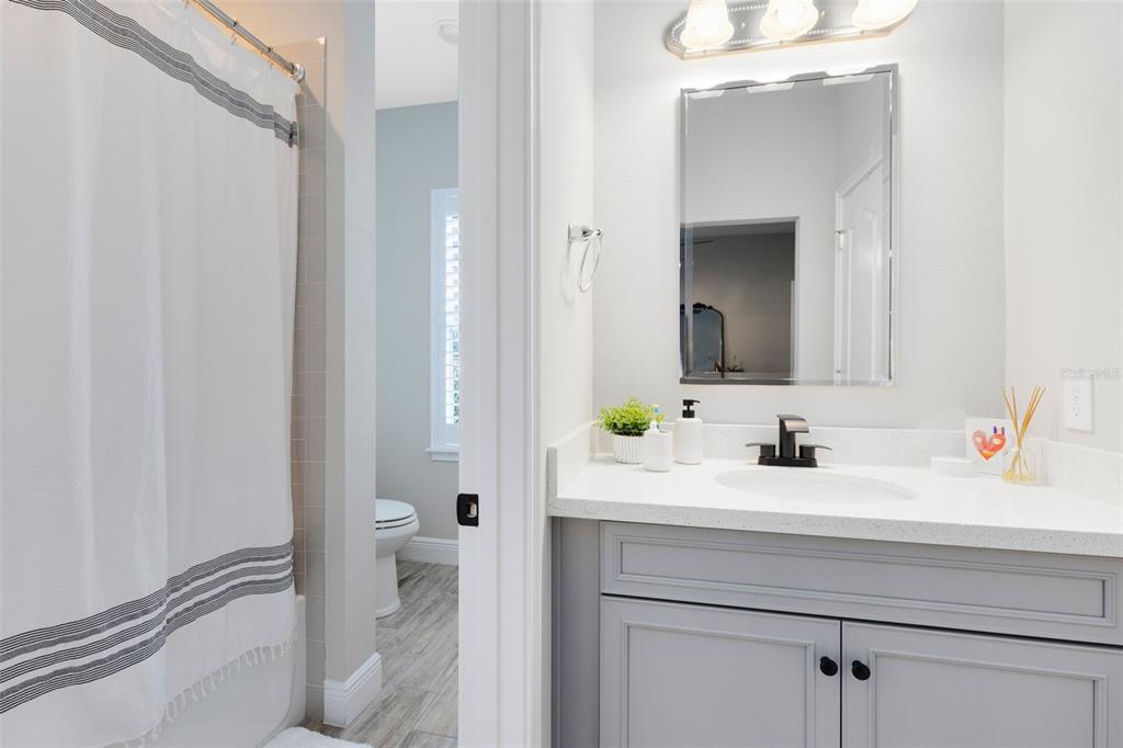 9374 Reymont Street Orlando, FL 32827 - Photo 20 of 54 a bathroom with a sink and a mirror