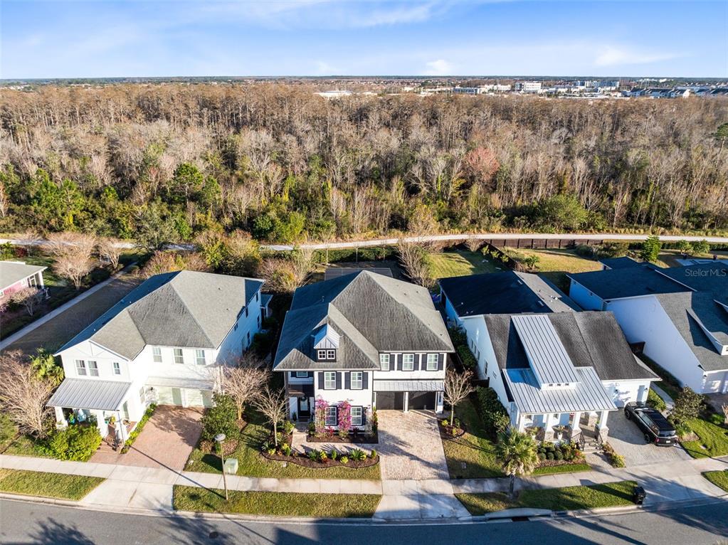 9374 Reymont Street Orlando, FL 32827 - Photo 2 of 54 an aerial view of residential houses with outdoor space and seating