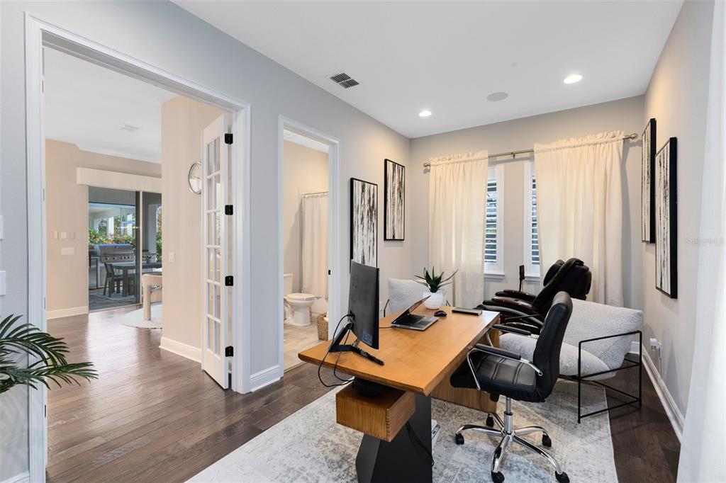 9374 Reymont Street Orlando, FL 32827 - Photo 32 of 54 a living room with furniture and wooden floor
