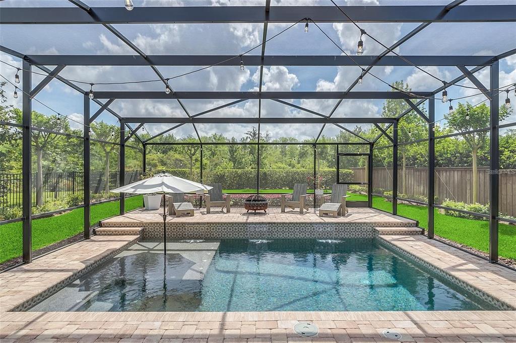 9374 Reymont Street Orlando, FL 32827 - Photo 41 of 54 a view of a swimming pool with a patio