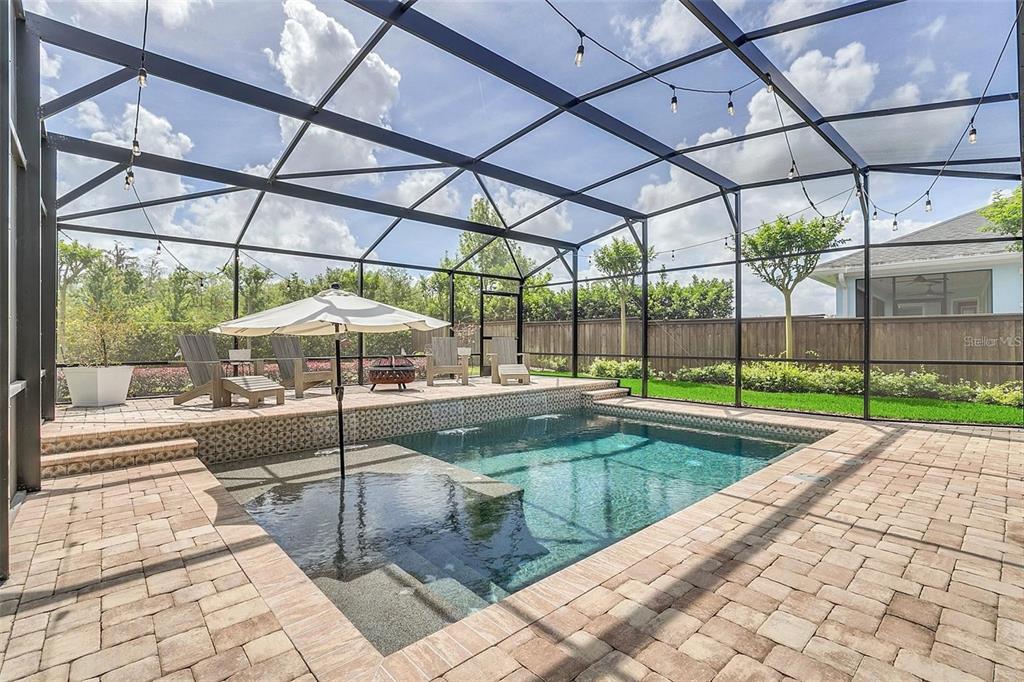 9374 Reymont Street Orlando, FL 32827 - Photo 42 of 54 a view of a backyard with sitting area