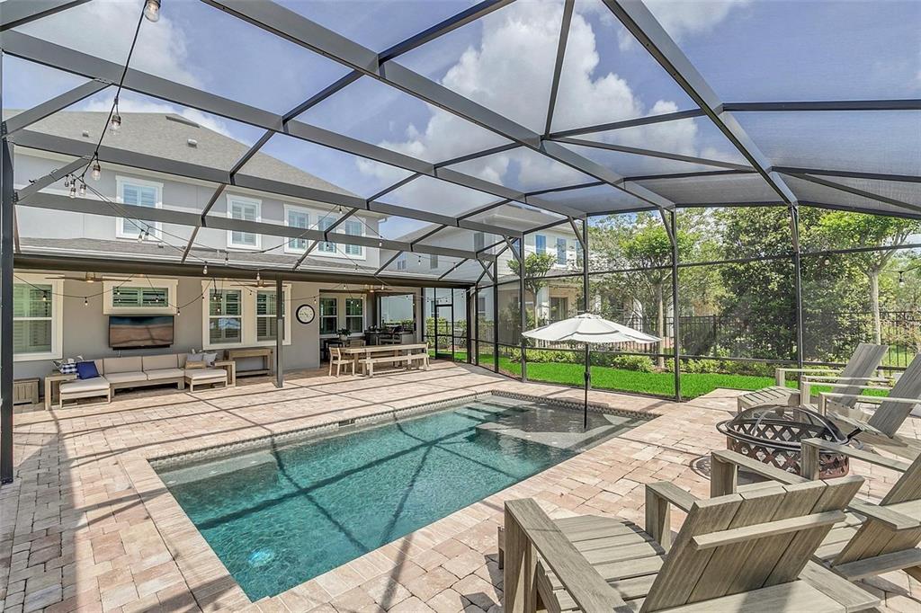 9374 Reymont Street Orlando, FL 32827 - Photo 43 of 54 a view of a patio with a table chairs and a patio