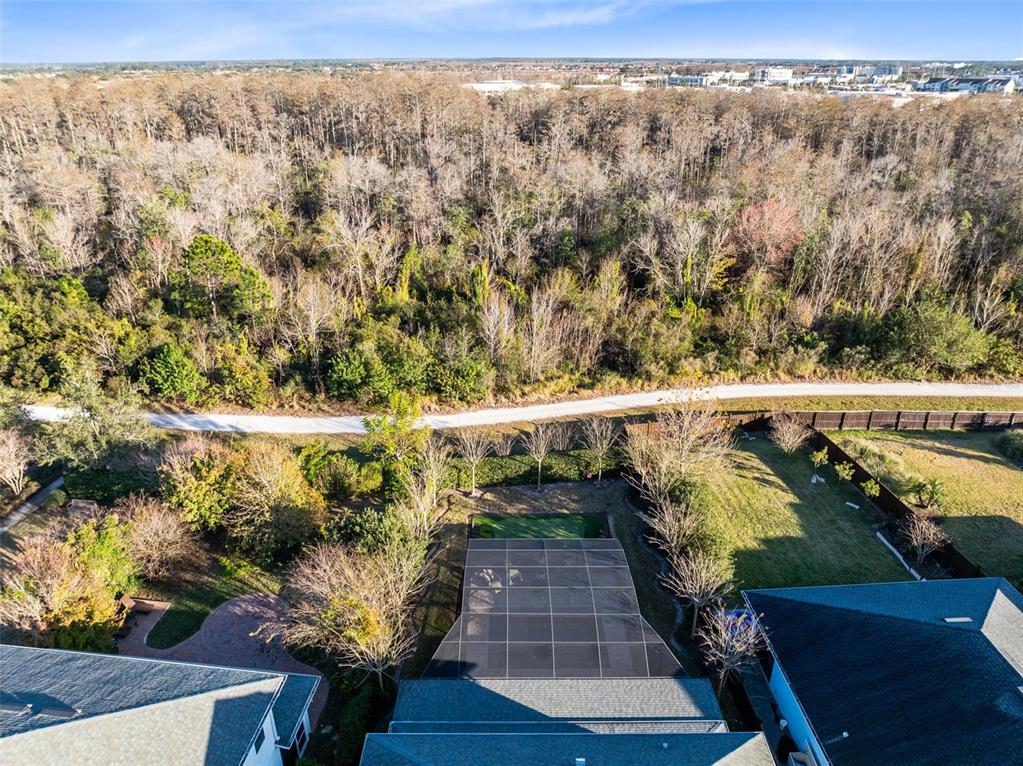 9374 Reymont Street Orlando, FL 32827 - Photo 51 of 54 a view of a balcony with chairs and wooden floor