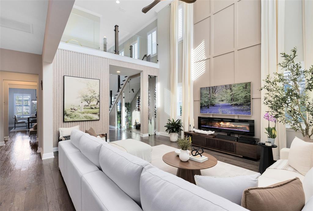 9374 Reymont Street Orlando, FL 32827 - Photo 7 of 54 a living room with furniture and a flat screen tv