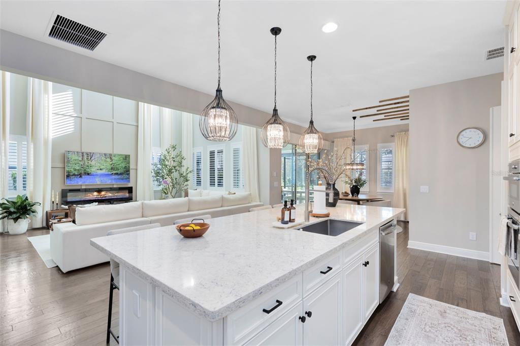 9374 Reymont Street Orlando, FL 32827 - Photo 10 of 54 a kitchen with counter space and living room