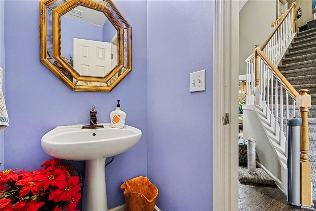 174 Senators Ridge Drive Dallas, GA 30132 - Photo 13 of 26 a bathroom with a sink mirror and toilet