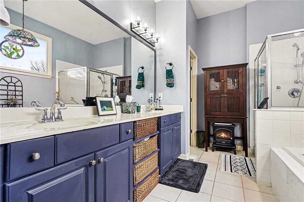 174 Senators Ridge Drive Dallas, GA 30132 - Photo 16 of 26 a bathroom with a sink a toilet and a mirror