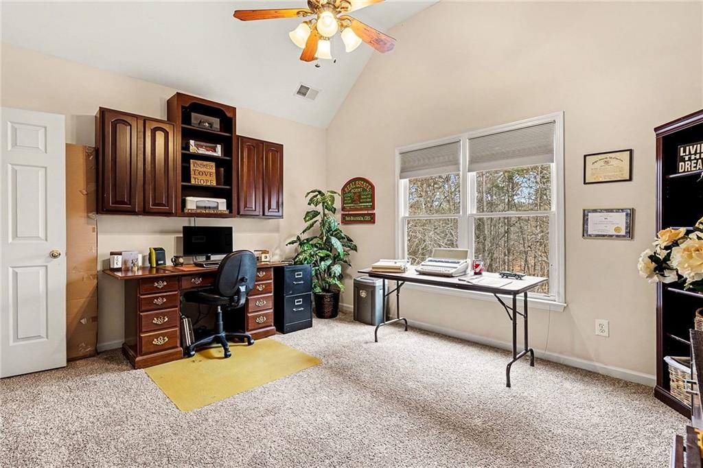 174 Senators Ridge Drive Dallas, GA 30132 - Photo 22 of 26 a living room with furniture a piano and a window