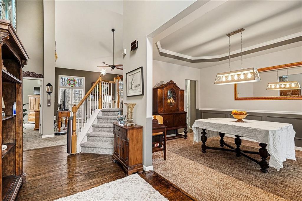 174 Senators Ridge Drive Dallas, GA 30132 - Photo 5 of 26 a room with lots of wooden furniture and a rug