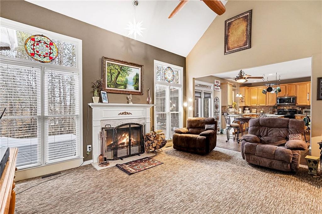 174 Senators Ridge Drive Dallas, GA 30132 - Photo 7 of 26 a living room with furniture window and a fireplace