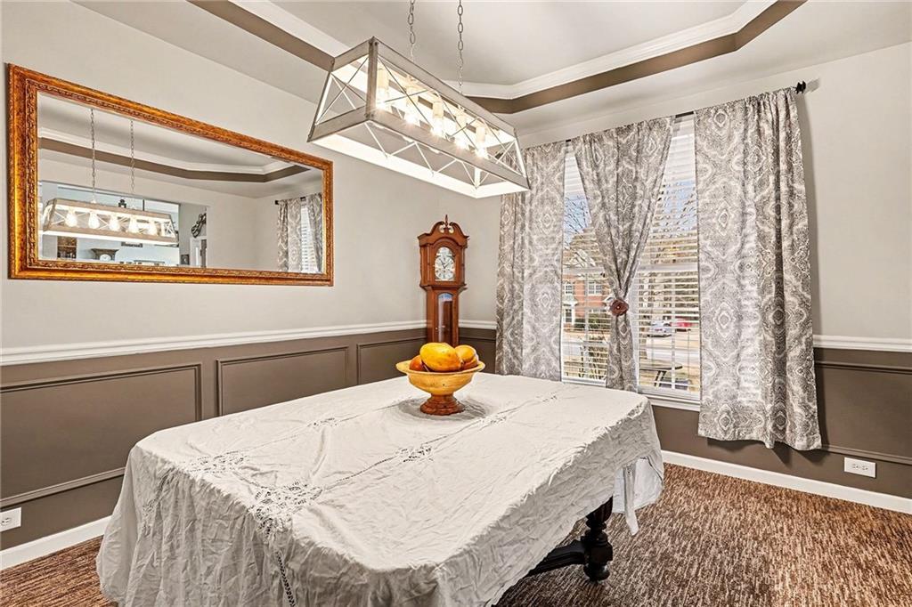 174 Senators Ridge Drive Dallas, GA 30132 - Photo 9 of 26 a bedroom with a bed and a chandelier