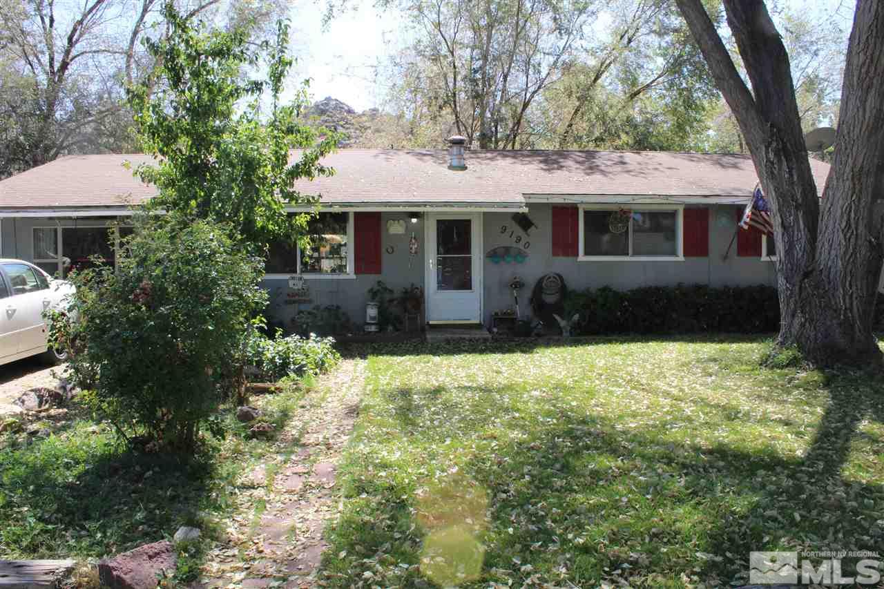 9190 Fremont Way Reno, NV 89506 - Photo 1 of 8 a front view of a house with a garden