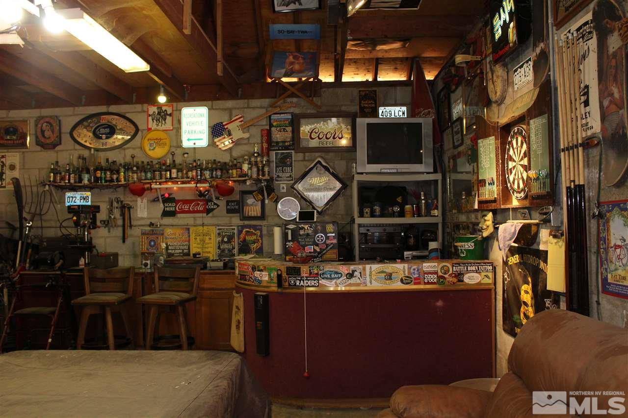 9190 Fremont Way Reno, NV 89506 - Photo 6 of 8 a store room with lots of different colored cloths