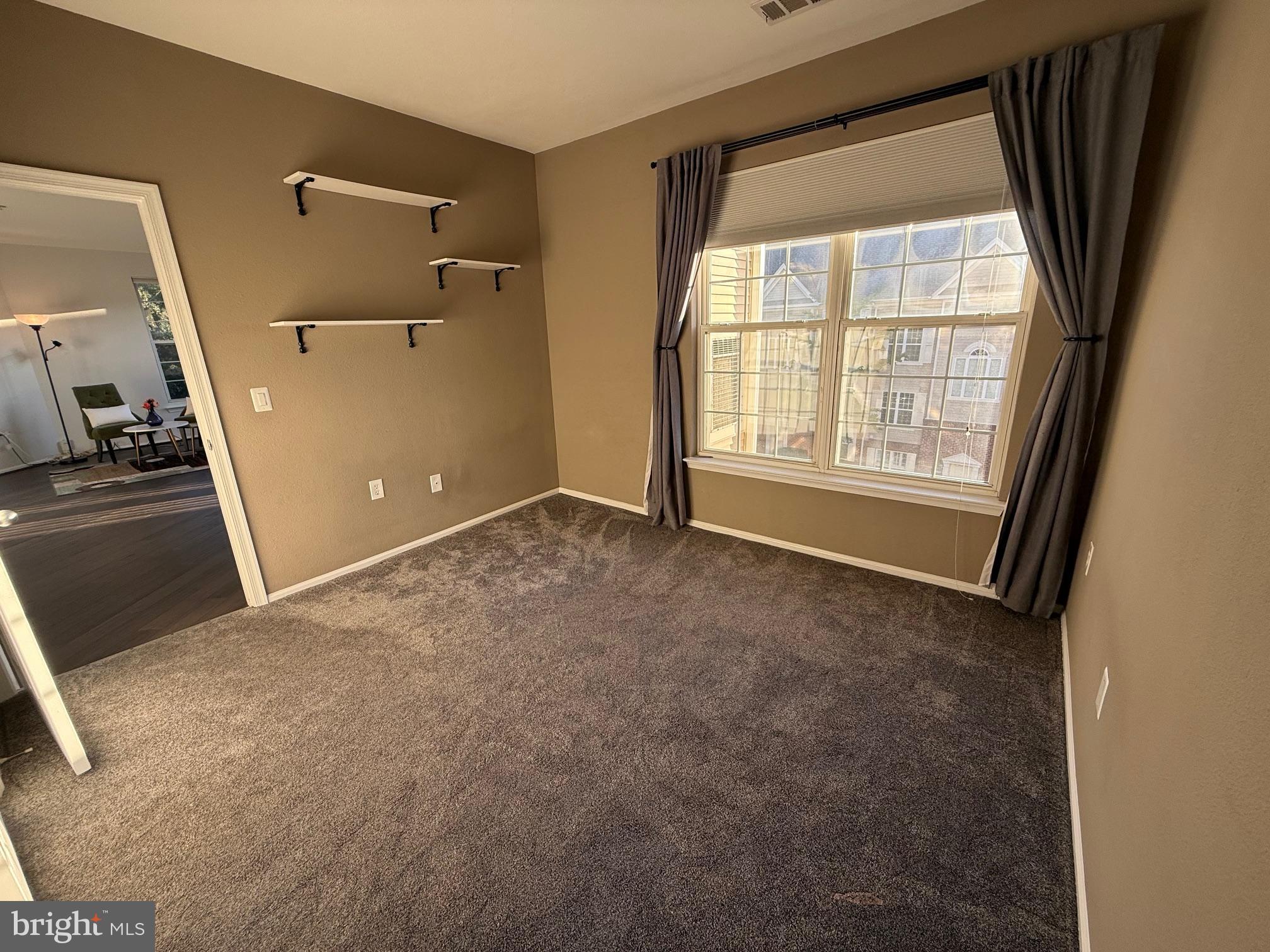 3009 Nicosh Circle, Unit 4302 Falls Church, VA 22042 - Photo 18 of 32 wooden floor and window in an empty room