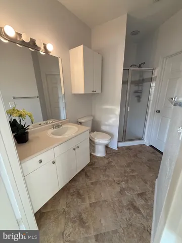 a bathroom with a sink toilet and vanity