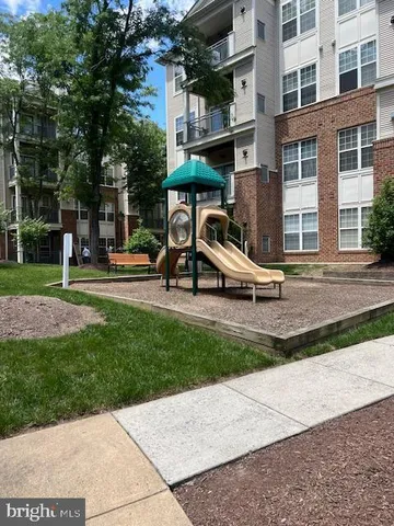 a front view of a house with swimming pool and outdoor seating