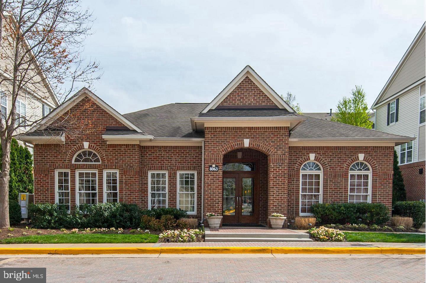 3009 Nicosh Circle, Unit 4302 Falls Church, VA 22042 - Photo 27 of 32 a front view of a house with swimming pool and outdoor seating
