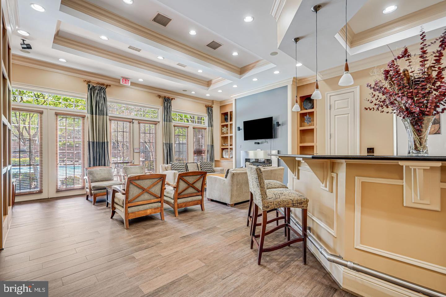 3009 Nicosh Circle, Unit 4302 Falls Church, VA 22042 - Photo 30 of 32 a living room with furniture and a flat screen tv